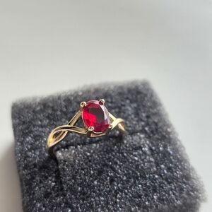 Gold Ring with Red Oval Gemstone - Elegant Women's Jewelry